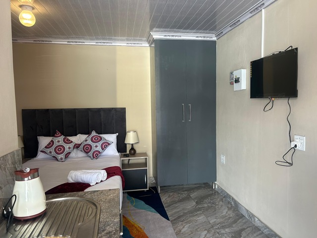 Room with TV and wardrobe