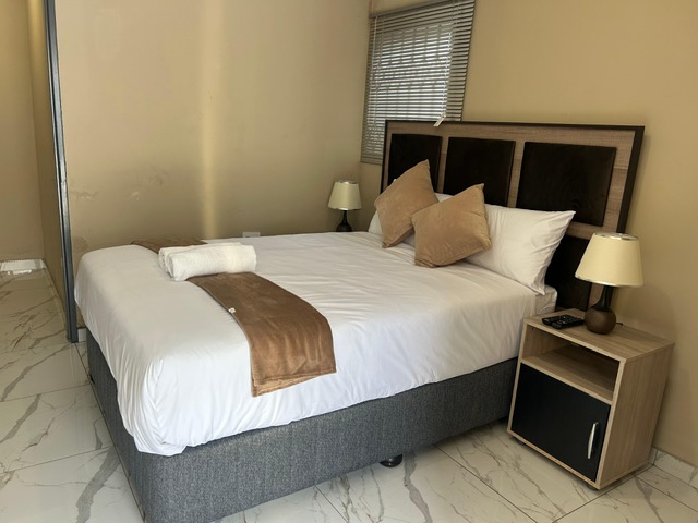Neatly made double bed