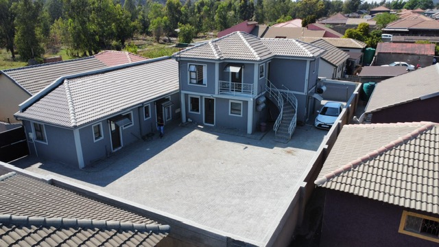 Paved courtyard and parking